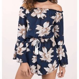 Reverse navy floral off-shoulder romper